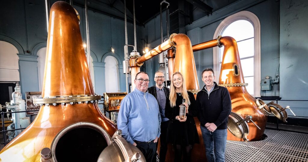 Belfast Distillery Raises £5 Million in Funding abundance, Apple, arm, caucasian, child, childhood, choosing, color, consumerism, cropped, east sussex, fresh, fruit and vegetable, green color, Groceries, hand, healthy eating, holding, horizontal, indoors, large group of objects, one person, peasmarsh, photography, Produce, shopping, sleeve, stack, Striped, supermarket, sweater, taking, UK Food and Beverage Business
