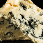 Cheese Manufacturer Issues Recall Due to E. coli Contamination abundance, alcoholic beverages, blue cheese, carafe, cheese, cheese manufacturer, cheese round, cutting board, dairy product, dark background, Day, Delicious, drink, e coli, Festive, flavor, food, food safety, glass - material, health risk, indoors, Indulgence, London, missing slice, nobody, port wine, recall, red wine, ripe, rustic food, savoury, still life, studio shot, taste, truckle, United kingdom, Vintage, wood, woodgrain pattern Food and Beverage Business