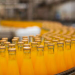 Mallows Bottling Invests £700k Annually in New Beverage Line £700k per year, automatic, beverage industry, Blue, bottle, bottling plant, business news, canister, Carbonated, close up, Drinking, drinks line, environmental conservation, factory, filling, freshness, gallon, glass - material, healthy lifestyle, heavy, in a row, indoors, industry, investment, invests, Juice, Machinery, Mallows Bottling, Manufacturing, motion, moving activity, no people, orange - fruit, orange color, Orange juice, packaging, plant, plastic, Purity, Robot, Small, Soda, technology, Water Food and Beverage Business