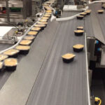 Garvey's 3D Infinity Accumulation Table Optimizes Frozen Food Production "frozen food, 3d, Accumulation Table, food processing, Here are some tags derived from the title: Garvey, Infinity, production, streamlining Food and Beverage Business