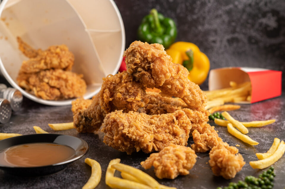 KFC to Source 35% of Its Chicken from UK Farmers architectural, banner, banners, brand, building, buildingfront, color, commerce, emblem, fastfood, Historic, icon, KFC, Manchester, redbrick, shopfront, signage, storefront, streetview, style, trees, Urban, windows Food and Beverage Business