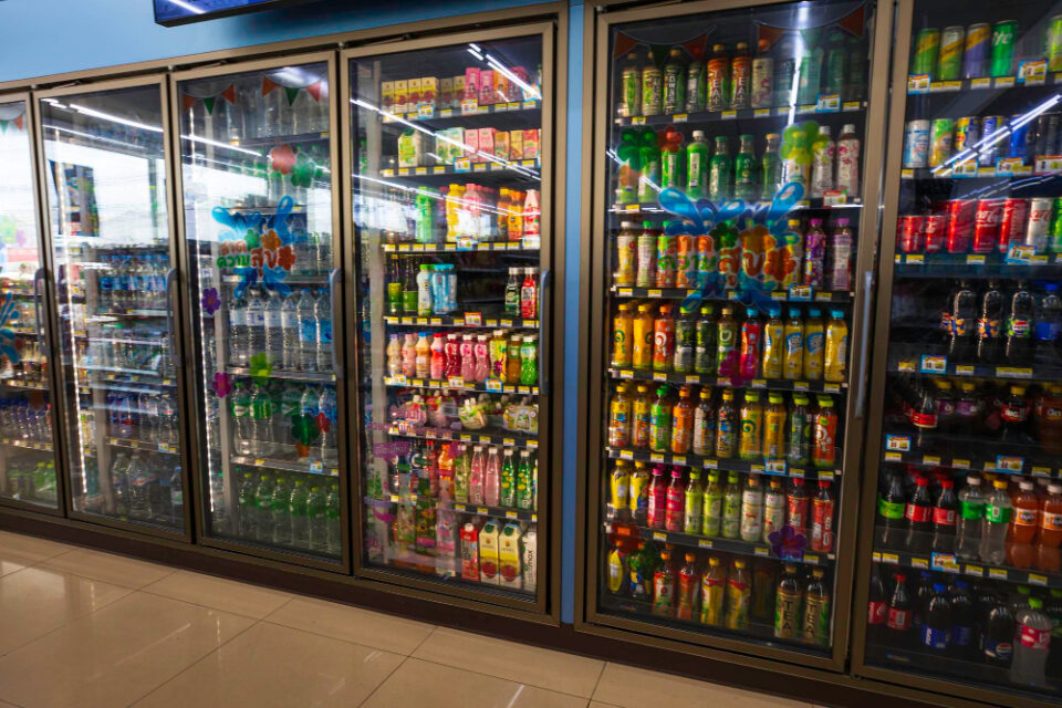 UK Soft Drinks Achieve Record Value in 2025 Despite Global Challenges beverages, big apple, chilled, Cold, commercial, daily life, Display, drinks, evening, glass door, Grocery, infrastructure, interior, Juice, lifestyle, lighting, manhattan, market, nyc, Perspective, Product, public space, Shelves, stocked, storefront, tourist attraction, united states, Urban, variety Food and Beverage Business