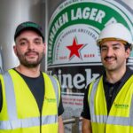 Heineken’s £28m Manchester investment nearly halves site CO2 emissions Amsterdam, beer - alcohol, beer bottle, bottle cap, cap, Collection, directly above, green color, Heineken, high angle view, high section, in a row, large group of objects, metal, Red, red star, retail display, star shape Food and Beverage Business