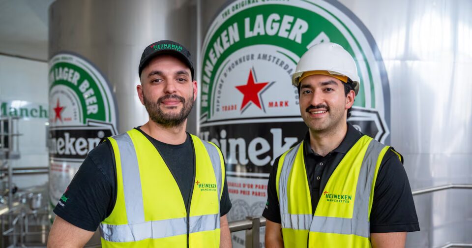 Heineken’s £28m Manchester investment nearly halves site CO2 emissions Amsterdam, beer - alcohol, beer bottle, bottle cap, cap, Collection, directly above, green color, Heineken, high angle view, high section, in a row, large group of objects, metal, Red, red star, retail display, star shape Food and Beverage Business