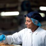 McVitie’s Owner Pladis Reports Mixed Results for 2025 assembly line, baked, biscuit, biscuit factory, close up, color image, conveyor belt, cookie, copy space, Edinburgh, efficient, factory, Food and Drink, food and drink industry, food processing plant, horizontal, in a row, indoors, industrial plant, medium group of objects, motion, nobody, order, packaging, photography, preparing, repetition, round, Scotland, selective focus, wrapped Food and Beverage Business