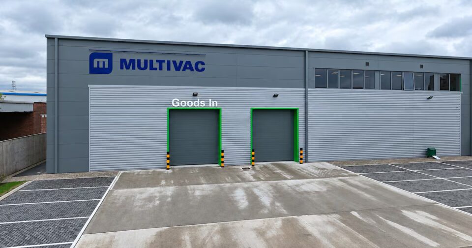 Multivac UK to Open New Innovation Centre in Manchester Next Year assembly line, baked, biscuit, biscuit factory, close up, color image, conveyor belt, cookie, copy space, Edinburgh, efficient, factory, Food and Drink, food and drink industry, food processing plant, horizontal, in a row, indoors, industrial plant, medium group of objects, motion, nobody, order, packaging, photography, preparing, repetition, round, Scotland, selective focus, wrapped Food and Beverage Business